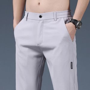 Summer Thin Ice Silk Stretting Mens Pants Business Casual Elastyczna talia gładka skłonność do spodni męska odzież marki 240527
