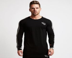 Novos homens de manga longa camiseta de algodão Raglan Sleeve Gyms Fitness Clothing Male Casual Fashion Marca Tops5032709