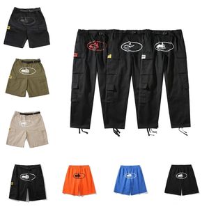 Męskie spodnie ładunki mężczyźni streetwear hip hop wydrukowane swobodne spodni wojskowe Retro Multi-Pockets Prosty luźne kombinezon przycisk Fly Para Prosta nogi Pantie