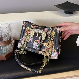 Kvinnors handväska Ny mångsidig högkvalitativ liten och populär modefärgad tryck på axelväskan