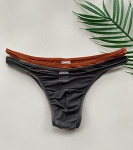 Mutande 2023 Design Brand Uomo Slip a righe sexy Custodia solida U Vita bassa Triangolo a rete Biancheria intima trasparente