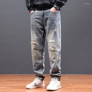 Jeans da uomo Primavera e Autunno Moda Pantaloni da mendicante con patch strappati dritti larghi Personalità casual