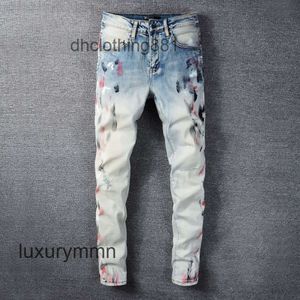 Jeans da uomo firmati Amirrss Jeans nuovo colore chiaro personalizzato splash paint point coltello foro tagliato marchio di moda maschile pantaloni coreani a gamba sottile BE8E