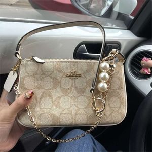 Sacos de designer feminino tote moda luxo couro mini mahjong 2023 nova corrente pérola pequena axila telefone móvel vendas diretas da fábrica