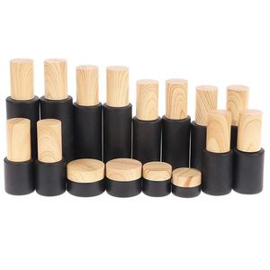 Bouteilles d'emballage en gros noir verre givré crème bouteille cosmétique lotion vaporisateur pots rechargeables vides avec couvercles en plastique de grain de bois Ot28W