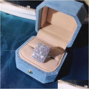 Con pietre laterali Scintillanti gioielli di lusso Unico fine 925 Sterling Sier Fl T Princess Cut Topazio bianco Cz Diamante Donna Fede nuziale Ri Dhbiq