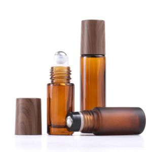 wholesale 100pcs 5ml 10ml 15ml Frosted Amber Glass Roll On Bottle With Metal Ball Thin Glass Roller Essential Oil Vials Bamboo Cap Jars LL