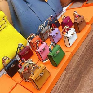 Mode mini väska designer plånbok hänge kvinnlig tot imitation läder mini söt headset kreativ bilnyckel