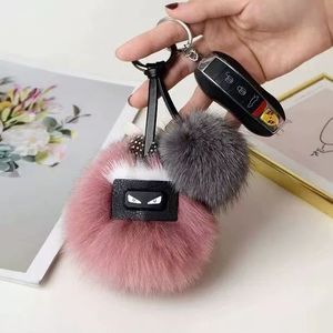 Fluffy Karl äkta tvättbjörn päls Pompom Monster Bag Bugs Charm Keychain Plush Key Ring Leather Tassel Pompom fnd