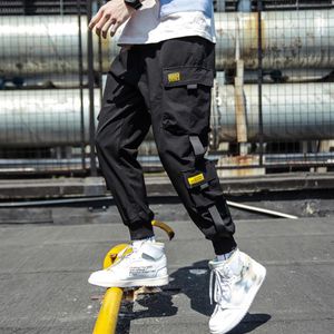 Marca designer primavera hip hop joggers homens preto harem calças multi-bolso fitas homem sweatpants streetwear casual masculino carga calças249o