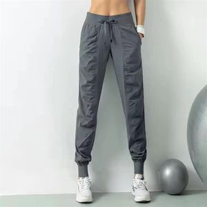 Ll kadın yoga koşu pantolon gevşek eşofmanlar kadın fitness spor joggers streç zayıflama ayakları ter pantolon243z