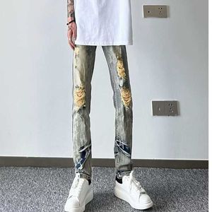 Verão nova lama amarela de cinco pontas estrela quebrada jeans para moda masculina High Street Jiangsu Zhejiang Shanghai Network Red Slim Fit Calças de Pés de Estudante