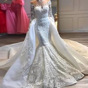 Strass Cristalli Abito da sposa Sirena africana Dresse Sheer O Neck Piega Manica lunga Abiti da sposa Applicazioni in pizzo Abiti da sposa Treno staccabile