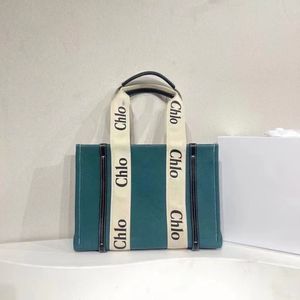 Ny designerpåse lyxiga kvinnor axelväskor handväska designer crossbody plånbok kvinnliga purses toppkvalitet hög kapacitet fast färg duk tote flera färger