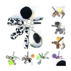 Mobiltelefonband charms 30 färger 9 st/sets försvar nyckelring set larm pompom hand sanitizer handled rem läppstift nyckelchains flaska op dhdds