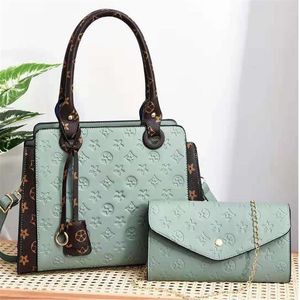 Kvinnors lyxdesigner väska messenger väska mamma baby kostym handväska mångsidiga axelväskor shopping handväskor264u
