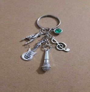 Key Rings Whole Vintage Silver Green star stone Music symbolmicrophoneguitarrock gesture Charm Keychain Fit Key Chains Accessories Je9206252 x0914