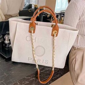 Bolsa de praia de lona de mão de luxo feminina bolsas clássicas grandes mochilas capacidade pequenos pacotes de corrente grande crossbody cpve h90
