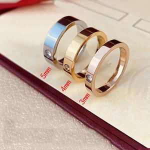 Top 10a Damenbrief Love Ring Mens Designer Ringe Paar Schmuck Titan Stahlband Fashion Classic Gold Sier Rose Farbe mit Diamanten Größe 5-11