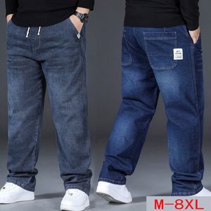 Мужские джинсы 8XL, синие прямые джинсовые брюки большого размера, мужские свободные брюки больших размеров, мужские повседневные эластичные брюки на талии, черные 230915