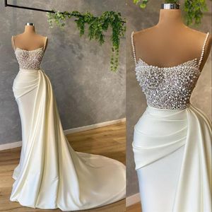 2021 Sexy Arabic Mermaid White Evening Dresses Wear Spaghetti Straps Sleevelesss Crystal Beads Pearls Satin Formal Prom Gowns Part201H