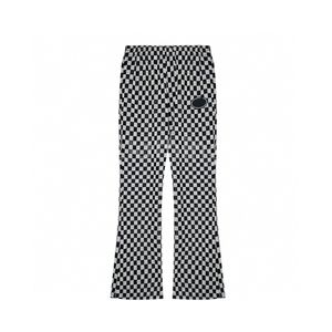 fall 2023 fashion trends Black and white plaid high-waisted wide-leg bell bottoms