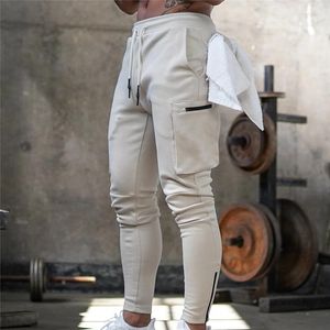 Calças masculinas homens jogger pnats sweatpants homem ginásios treino de fitness calças de algodão masculino casual moda magro pista zíper design
