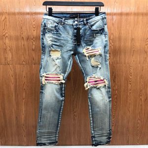 Falection mens 21fw jeans de alta qualidade angustiado motocicleta motociclista jean magro rasgado buraco listra moda coelhos roxos 241s