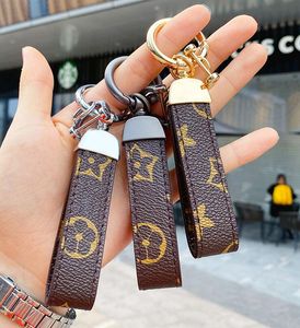 Luxur Designer Pu Leather KeyChain Designer Key Chain Buckle Lovers Car Handgjorda nyckelringar Män kvinnor väska hängande tillbehör