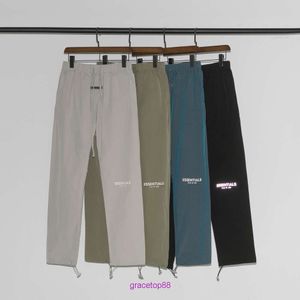 4q0z Stilista 2023 Pantaloni da uomo Doppio Filo Marca Essentia Riflettente Colorato High Street Abbigliamento da lavoro Stile Coulisse Nylon Casual per Uomini e Donne