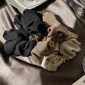 Französische schwarze Satin-Haargummibänder Herbst Neues High Sense Triumphbogen-Haarseil Klassisches Design Luxus-Kopfbedeckung Charme Damen Liebesgeschenk Kopfseil