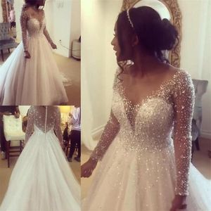 Bling bling illusion långa ärmar prinsessan bröllopsklänning 2020 Sheer halsringning juvelkristallpärlor a-line imperium midja afrikansk weddi256m