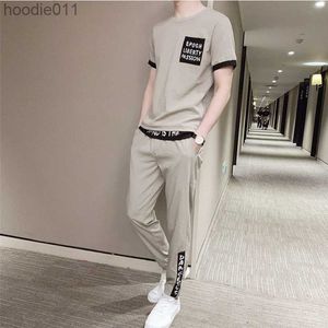 Herrspåriga toppbyxor sätter coolt grundläggande spårdräkt regelbundet passar billig manlig t -shirt 2 bit outfit stretch sport kostymer elastiska kläder för män l230921