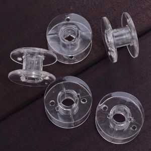 Ankomst 1000st Clear Plastic Empty Bobbins för bror Janome Singer Symaskiner Kläder Leverans Top Notions Verktyg3123