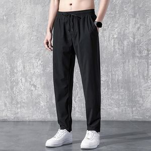 Herrbyxor med djupa fickor Löst passande Casual DrawString Jogging Trousers för att köra träningsbasket för träningspass