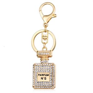 Accessori pendenti da donna con portachiavi con ciondolo automatico moda creativa con bottiglia di profumo 264M