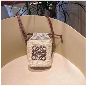 Palha francesa tecida 2023 New Luo Jia Hand Twoven Feminino Balde de Água Um ombro Crossbody Small Bag Summer