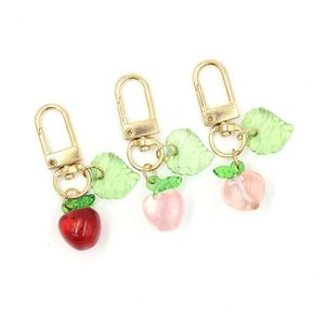 Portachiavi all'ingrosso Donne Ragazze Ciondolo frutta Portachiavi Acrilico Mela Pesca Cerniera Pl Fascino Planner Accessori Charms Hangbag Appeso Dhhbs