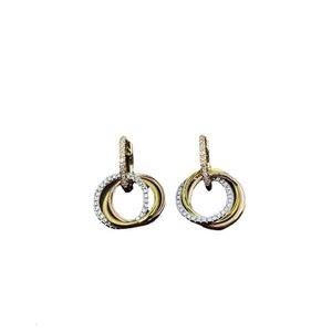 Örhängen Carttiers Designer Luxury Fashion Women Live Utsökta kvinnors smycken Tri Ring Inlaid Diamond Ear Hanger 925 Silver Ear Studs Enkla och modeörhängen