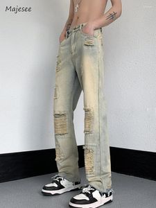 Jeans da uomo Uomo Hole Vibe Stile americano High Street Scava fuori Pantaloni in denim lavato vintage vintage alla moda College semplice