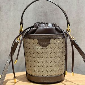 Mini kova çanta üst tutamak çanta kadınlar çapraz tote çanta çekme namlu çanta lüks tasarımcı omuz çantası çantası tuval deri altın donanım ayarlanabilir kayış