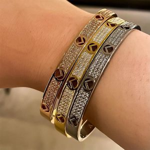 Bracciale con chiodo a vite con ciondolo in acciaio al titanio e oro. Bracciale rigido con polsino. Bracciale per uomo e donna, amanti delle coppie di nozze, gioielli regalo N207t