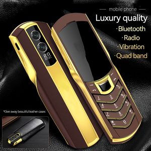 Luxury Gold Business Cell Phone Unlocked 2G GSM Dual Sim Card Mobiltelefoner Rostfritt stål Body FM Radio Bluetooth Dial Camera Magic Voice Cellphone Free Case