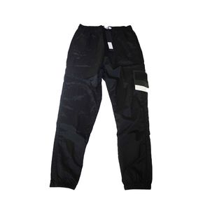 2023 Novas calças bordadas com patch lateral masculinas e femininas calças de moletom de nylon de metal de secagem rápida respiráveis calças de distintivo