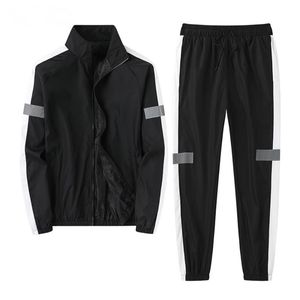 Herrspår 2023 Spring- och Autumn Sports Suits Jackets byxor Fashion Reflective Strips Couples Loose Suit