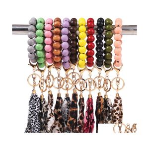 Key Rings High Quality Suede Tassel Wood Beads Beaded Bracelet Keychains Drop Delivery Jewelry Dhr7J