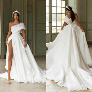 One Shoulder Float Wedding Dresses Lår High Slit Appliced ​​2020 Nya brudklänningar med Big Bow Sweep Train de Mariee338h