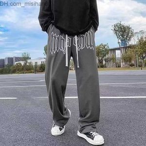 Pantaloni da uomo Lettera in stile americano stampato pantaloni dritti maschi stradini sciolti sciolti jogger casual jogger hip-hoppants hip-hop z230802