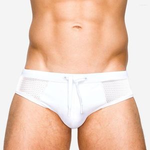 Costumi da bagno da uomo in nylon europeo e americano con cuciture in rete, costume da bagno bianco, pantaloncini da bagno da spiaggia sexy traslucidi estivi con push pad