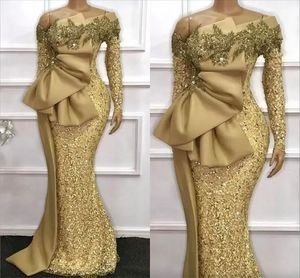 Gold African Mermaid aftonklänningar Glittrande paljetterade långa ärmar Big Bow Satin Peplum Prom Party klänningar plus storlek arabiska aso ebi kvinnor vestidos de festa al971